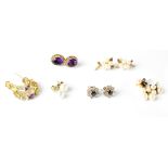 Six pairs of earrings to include half hoop with multicoloured stones, sapphire cluster earrings,