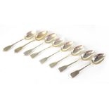 A set of six George IV hallmarked silver 'Fiddle' pattern dessert spoons, initialled D,