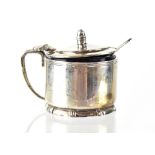 A George VI hallmarked silver mustard pot with blue glass insert, William Greenwood & Sons,
