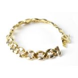 A modern 9ct two-tone gold cross link bracelet, length 20cm, approx 18.3g.