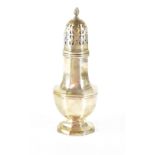 A hallmarked silver sugar caster of octagonal baluster form with pierced lid, on an octagonal foot,