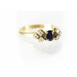 An 18ct gold diamond and sapphire ring,