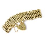 A 9ct gold gate link bracelet with 9ct gold heart clasp, gold safety chain, length 17cm, approx 27g.
