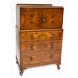 A 20th century walnut cabinet, two small cupboard doors with one interior shelf,