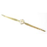 Rotary; a ladies' 9ct gold 21 jewel wristwatch, the silver dial set with raised baton markers,