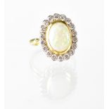 An 18ct gold opal and diamond cluster ring,