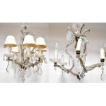 A pair of six-branch glass chandeliers with cut pear-shaped drops and flower embellishments,