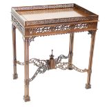 A 20th century fret carved hardwood side table in the Oriental style with single frieze drawer