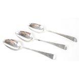 Three hallmarked silver tablespoons with a similar decorative pattern to the handles to include two