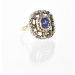 A late 19th century yellow metal diamond and sapphire cluster ring,