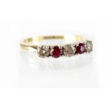 A ruby and diamond half eternity ring,