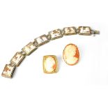 A carved shell cameo on yellow metal square brooch with raised hearts to the corners,