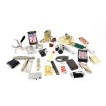 A collection of pocket cigarette lighters and table lighters.