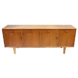GORDON RUSSELL; a mid-20th century serpentine fronted Bombay rosewood sideboard with four drawers