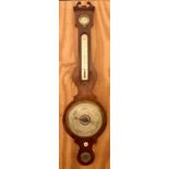 A late 19th/early 20th century mahogany banjo barometer and thermometer with silvered dials and