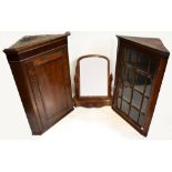 Two 18th century oak corner cabinets, the first with glazed door enclosing three shelves, 104 x