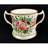 A Victorian porcelain twin handled loving cup, one side inscribed in gilt 'Henry & Ann Mellourn