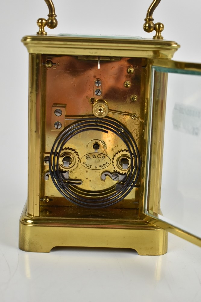 A late 19th century French brass carriage clock, the white enamel dial set with Roman numerals - Image 5 of 6