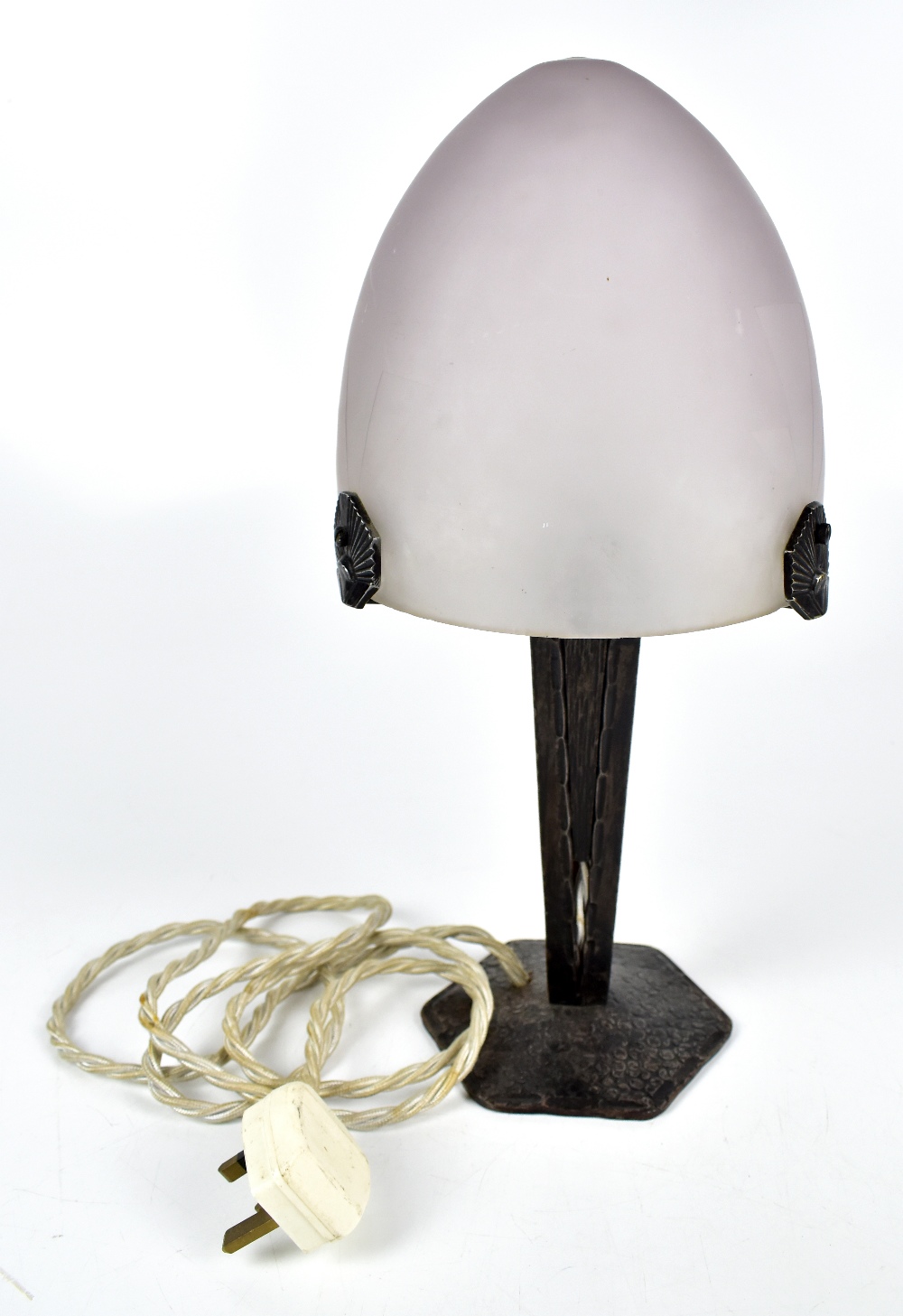 A reproduction Art Deco style table lamp with frosted glass shade featuring etched geometric detail,