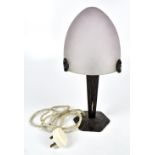 A reproduction Art Deco style table lamp with frosted glass shade featuring etched geometric detail,