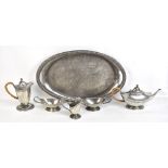 TUDRIC PEWTER FOR LIBERTY & CO; a six piece hammered pewter tea service and twin handled tray,