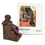 KARIN JONZEN (1914-1998); a bronzed resin sculpture depicting a girl leaning on steps, impressed