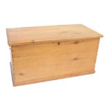 A late Victorian pine blanket box with hinged lid and inner candle, width 93cm.Additional