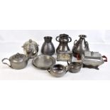 A collection of Arts & Crafts pewter to include an English Pewter three handled vase, impressed