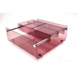 A mid-century Perspex coffee table with chrome frame and supports, with two opening flaps, length