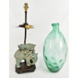 A modern table lamp, a green glass vase, and a modern glazed figure of an elephant (af) (3).