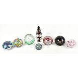 Eight assorted paperweights to include Gentile Star City example with scattered cane decoration,
