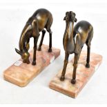 A pair of Art Deco style bronzed metal deer on rouge marble bases, unsigned, 21 x 19.7cm (2).