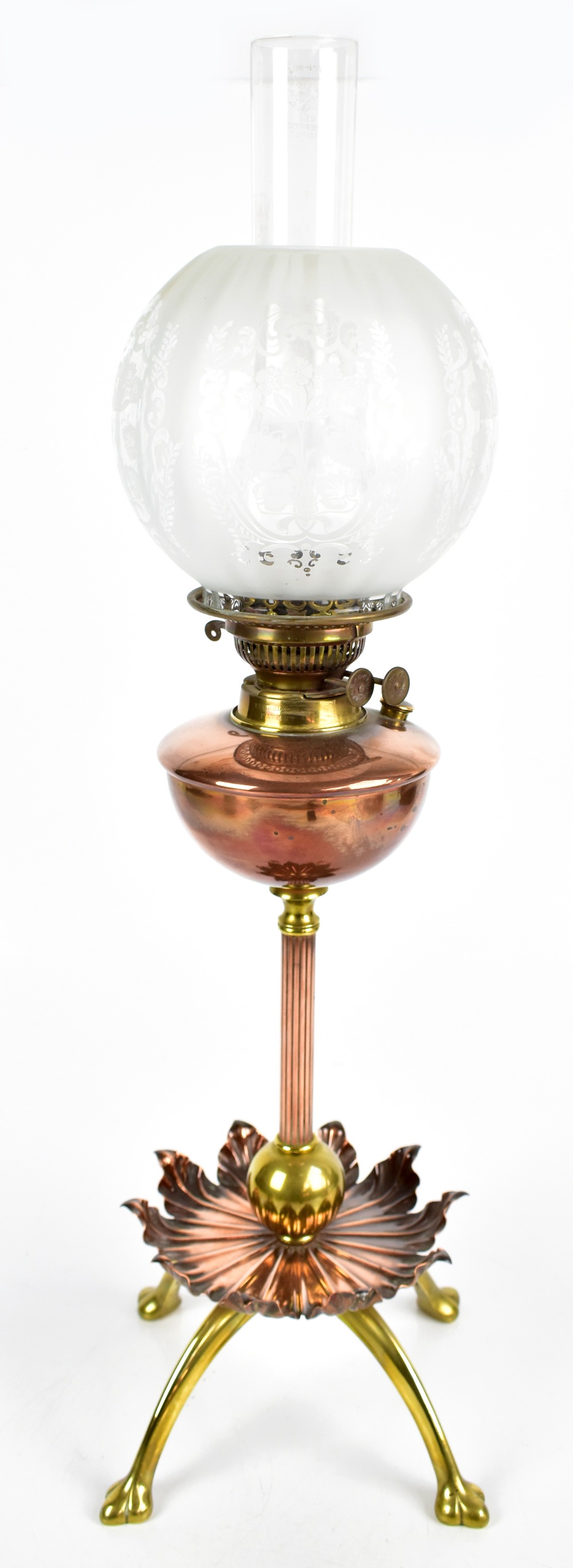 WILLIAM ARTHUR SMITH BENSON (1854-1924); an Arts & Crafts copper and brass oil lamp raised on single