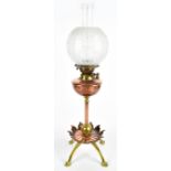 WILLIAM ARTHUR SMITH BENSON (1854-1924); an Arts & Crafts copper and brass oil lamp raised on single