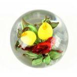 RICK AYOTTE; a glass paperweight encased with exotic bird and fruit, signed, no.M-88 and dated