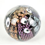 PETER VANDERLAAN; a glass paperweight encased with stylised detail, signed and dated 2003 to base,