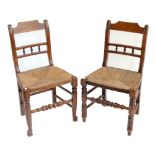 A set of seven country made stained beech and oak rush seated bar back dining chairs (7).