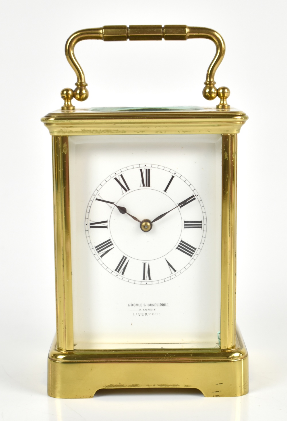 A late 19th century French brass carriage clock, the white enamel dial set with Roman numerals