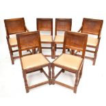ROBERT 'MOUSEMAN' THOMPSON OF KILBURN; a set of six oak dining chairs with panel backs and leather