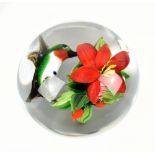 RICK AYOTTE; a contemporary glass paperweight encased with bird and floral spray, signed, no.M-90