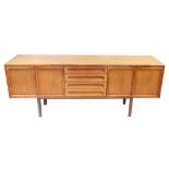 MEREDEW; a mid-century teak sideboard with an arrangement of four drawers flanked by four panelled