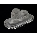SAINT-LOUIS; a frosted glass paperweight in the form of a recumbent lion, embossed marks to base,