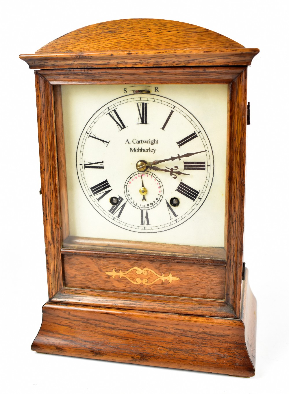 An Edwardian oak mantel clock with later printed dial set with Roman numerals, inscribed 'A.