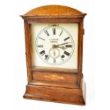 An Edwardian oak mantel clock with later printed dial set with Roman numerals, inscribed 'A.