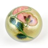DANIEL SALAZAR FOR LUNDBERG STUDIOS; an iridescent glass paperweight encased with floral detail,