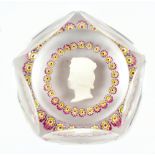 ST LOUIS; a contemporary faceted glass paperweight encased with sulphite and millifiore scattered