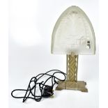 A reproduction Art Deco style table lamp with frosted glass shade and impressed chevron and floral
