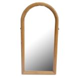 A domed pine mirror formally from a cheval mirror, height 131cm, width 64cm.Additional InformationIt
