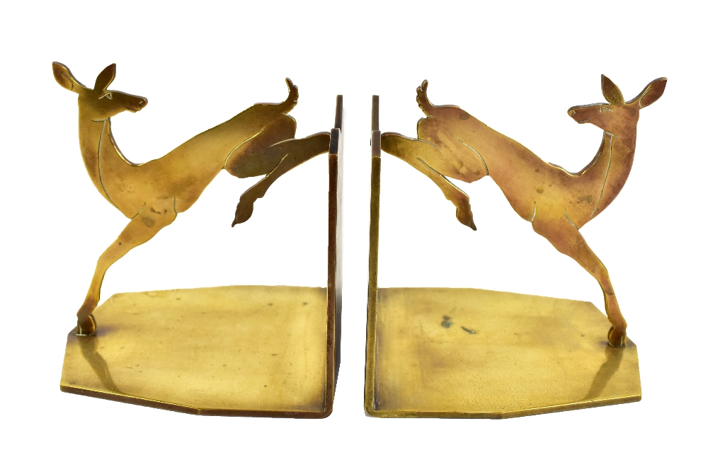 A pair of Art Deco brass bookends modelled as leaping deer, height 12cm.Additional InformationOne is