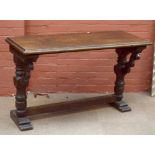 An oak hall table with carved detail on block and ring turned stretchered supports, height 79cm,